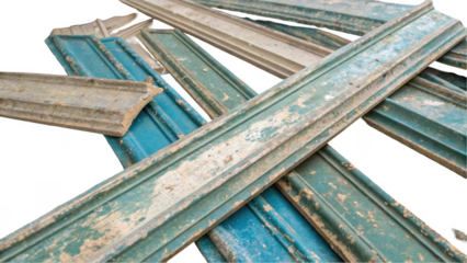 Discarded painted skirting boards are laying on top of each other with a transparent background, perfect for easy integration into any design project