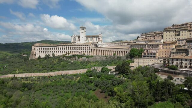 EUROPE, ITALY ASSISI 06,04,2025 The Basilica of Saint Francis San Francesco  in Assisi, Umbria.Drone aerial view of Papal Patriarchal Basilica of Saint Francis and the historic city with tiled roofs