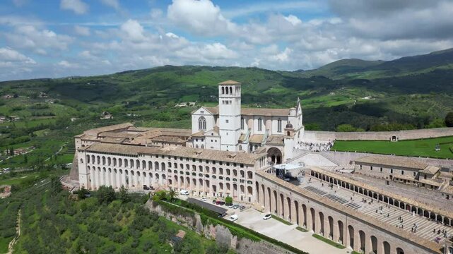 EUROPE, ITALY ASSISI 06,04,2025 The Basilica of Saint Francis San Francesco  in Assisi, Umbria.Drone aerial view of Papal Patriarchal Basilica of Saint Francis and the historic city with tiled roofs