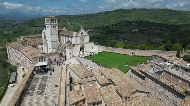 EUROPE, ITALY ASSISI 06,04,2025 The Basilica of Saint Francis San Francesco  in Assisi, Umbria.Drone aerial view of Papal Patriarchal Basilica of Saint Francis and the historic city with tiled roofs