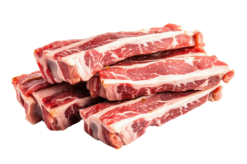 A close up of a pile of raw short ribs with visible marbling stacked on top of each other on black