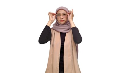 A cheerful young Muslim woman in hijab expressing various emotions on white background, suitable for lifestyle, advertisement, and cultural diversity concepts