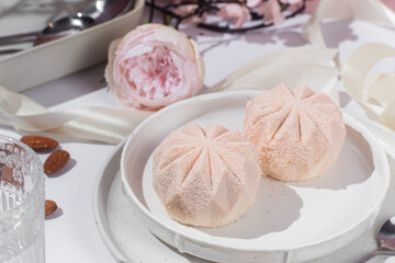 Mousse cake . Beautiful cake covered with Velour  in a plate on the table. Confectionery, coffee shop