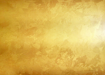 Elegant gold texture for luxurious design. Abstract surface with glitter and spots. Universal gold background for creative projects in fashion.