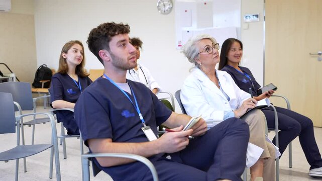 Medical team attending a conference in hospital room