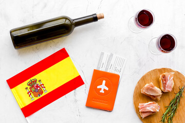 Travel to Spain. Passport and airplane tickets with traditional Spanish meal