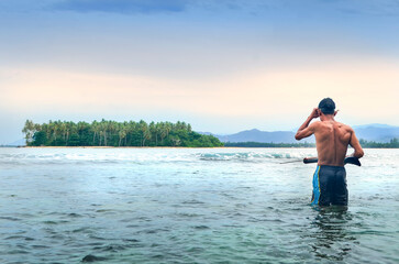 Fototapeta premium Traditional Fisherman Spearfishing in Tropical Sea Near Island