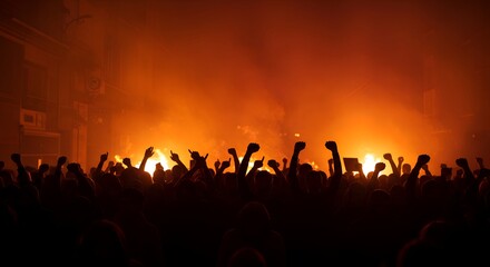 Fototapeta premium Crowd Silhouettes at an Event with Raised Hands