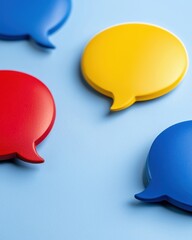 Colorful Speech Bubbles on a Light Blue Background Representing Communication and Conversation Concepts