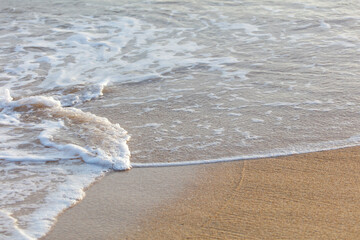 The ocean is calm and the waves are small