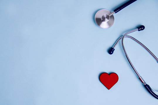 Medical stethoscope and red heart, top view. Health care and heart check concept.