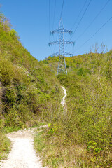 Obraz premium A power line tower is seen in the distance