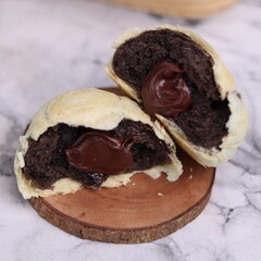 Chocolate pia bread with melted chocolate filling. in the photo with a white background