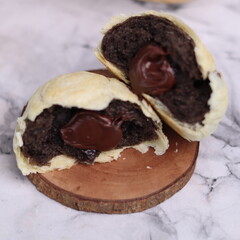 Chocolate pia bread with melted chocolate filling. in the photo with a white background
