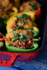 Stuffed Peppers with Meat, Rice, and Vegetables in a Baking Dish
