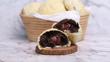 Chocolate pia bread with melted chocolate filling. in the photo with a white background