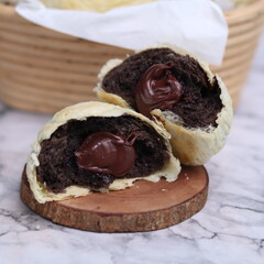 Chocolate pia bread with melted chocolate filling. in the photo with a white background