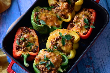 Stuffed Peppers with Meat, Rice, and Vegetables in a Baking Dish