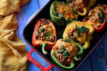 Stuffed Peppers with Meat, Rice, and Vegetables in a Baking Dish