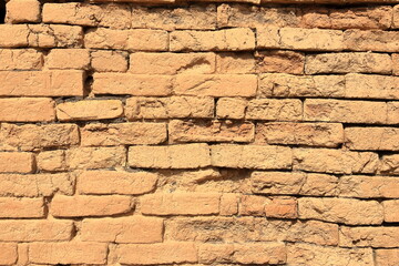 Brick wall texture. Orange yellow red brick building wall, Iraq, Middle East