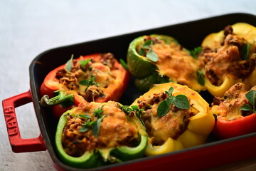 Stuffed Peppers with Meat, Rice, and Vegetables in a Baking Dish