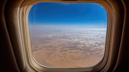 Fototapeta premium Airplane Window View of Desert and Sky