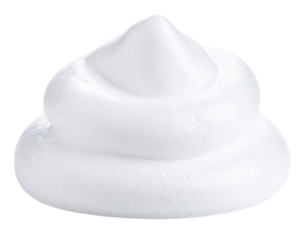 Fluffy white shaving foam swirled into a soft peak.
