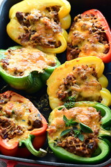 Stuffed Colorful Bell Peppers with Beef, Bulgur, and Cheese in Rustic Mediterranean Style
