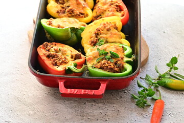 Stuffed Peppers with Meat, Rice, and Vegetables in a Baking Dish
