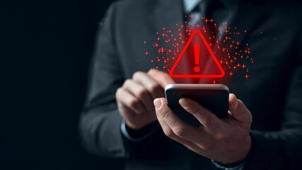 Man using smartphone with red triangle exclamation mark icon shows executive warning and notice alert for urgent mobile notifications