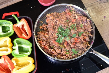 Meat cooking in a frying pan. A vibrant and appetizing dish prepared with fresh ingredients, ideal...