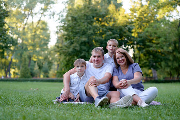 Fototapeta premium Happy Family Enjoying Quality Time Together Outdoors in a Park..