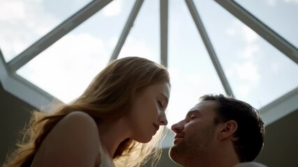 A romantic couple sharing a kiss under a skylight, with soft natural light enhancing the intimate atmosphere and a serene background - hot kissing bed - Powered by Adobe