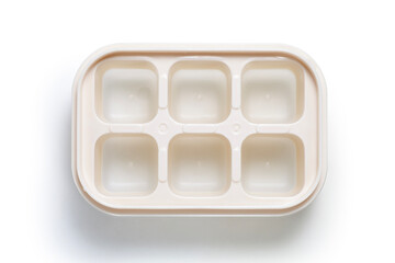 empty plastic ice block mold on white background, top view
