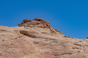 Fototapeta premium Aztec Sandstone, Early Jurassic geological formation of primarily eolian sand . Mouse's Tank Road, Valley of Fire State Park, Clark County, Nevada geology.