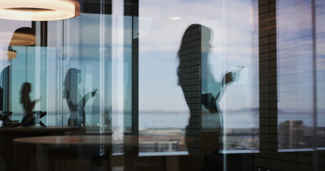 Window, silhouette and business woman with phone for communication, text or check insurance email....