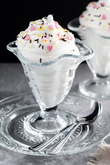 Whipped Cream Delight with Sprinkles on gray and black background