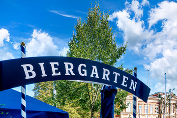 Entrance to a beer garden sign in Gotha under summer sky