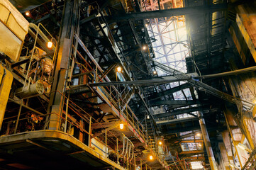 Fototapeta premium Industrial interior with metallic structures and lighting showcasing an operational factory environment in the heart of the city