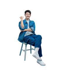 Full body image of young asian man sitting on chair and posing on PNG background