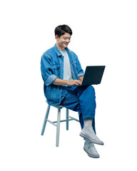 Full body image of young asian man sitting on chair , using laptop and posing on PNG background