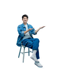 Full body image of young asian man sitting on chair and posing on PNG background
