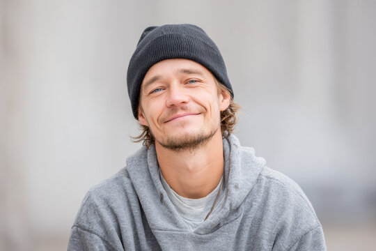 closeup portrait of american homeless person with exaggerated bright emotion showcasing surprised and delighted