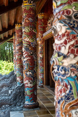 A beautiful and vibrant row of colorful pillars found in a temple