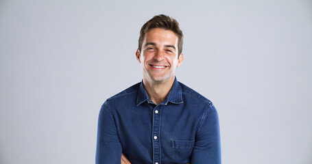 Portrait, fashion and man in studio, smile and pride with confident personality on gray background...