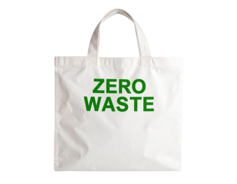 White reusable tote bag with "ZERO WASTE" written in green text on the front.