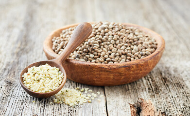 Hemp seeds in closeup on wooden board