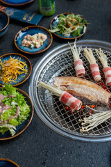 A delicious plate of food featuring meat and mushrooms cooked on a grill