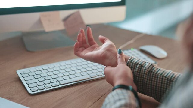 Typing, carpal tunnel and hands of businesswoman in office with wrist pain, injury or accident with fibromyalgia. Keyboard, osteoporosis and female copywriter with muscle sprain by desk in workplace.