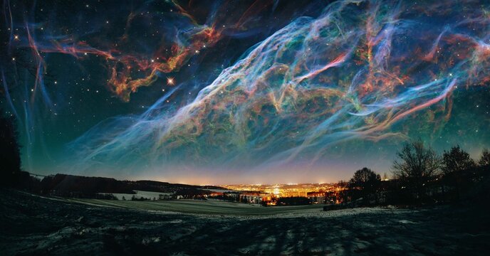 Stunning night sky with colorful nebula over a cityscape, showcasing the beauty of the universe and urban lights